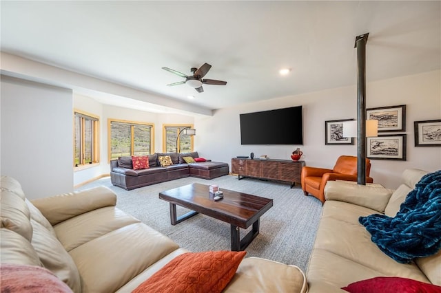 living room with carpet floors and ceiling fan