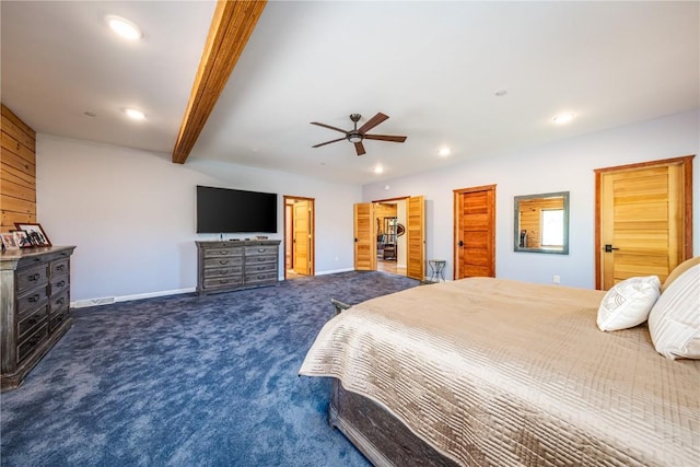 bedroom with ceiling fan, beamed ceiling, and dark carpet