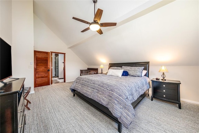 carpeted bedroom with ceiling fan and vaulted ceiling