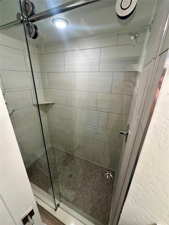 bathroom with an enclosed shower