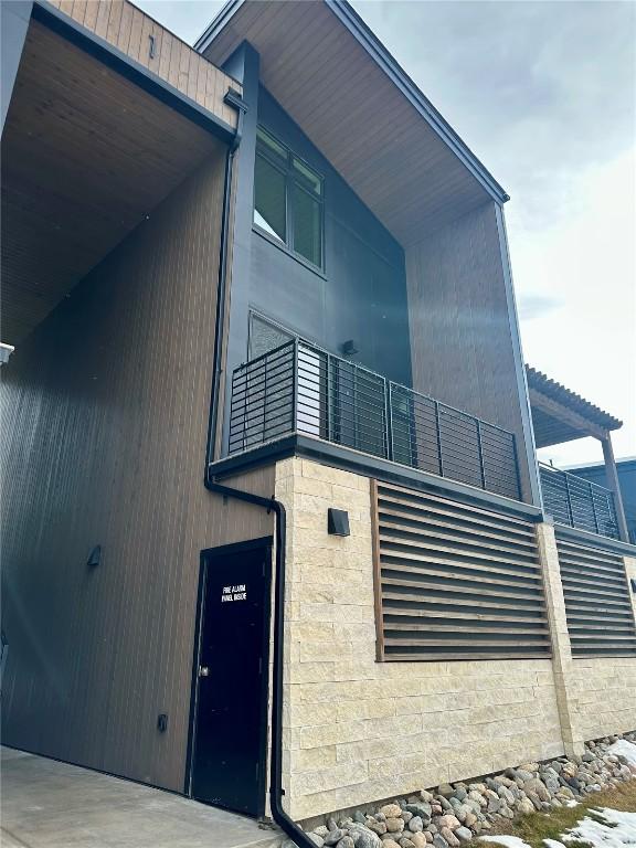 view of side of property featuring a balcony