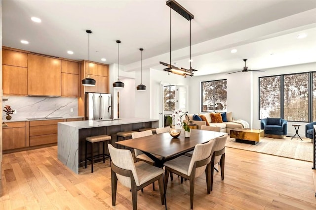 dining area featuring recessed lighting, a ceiling fan, and light wood-style floors