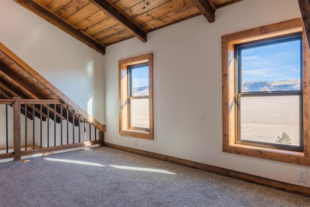 interior space with lofted ceiling with beams, carpet floors, and wood ceiling