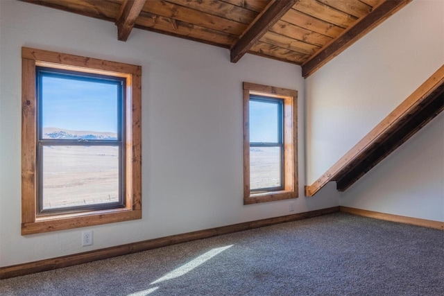 bonus room with lofted ceiling with beams, wood ceiling, and carpet floors