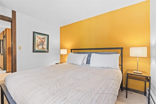 carpeted bedroom with a textured ceiling