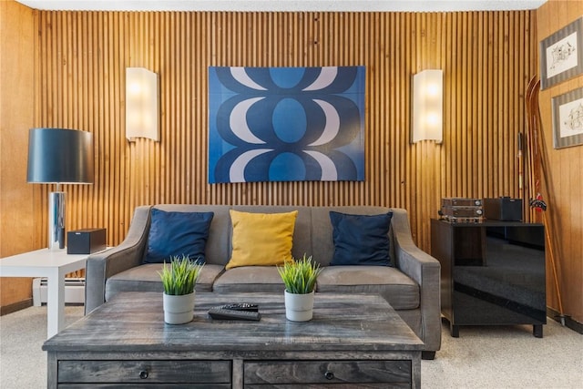 living room featuring wooden walls and a baseboard radiator