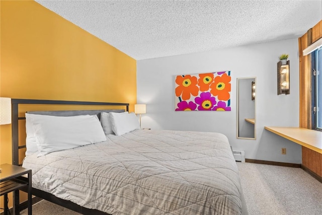 carpeted bedroom with a baseboard heating unit and a textured ceiling