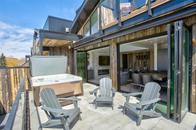 view of patio / terrace featuring a hot tub