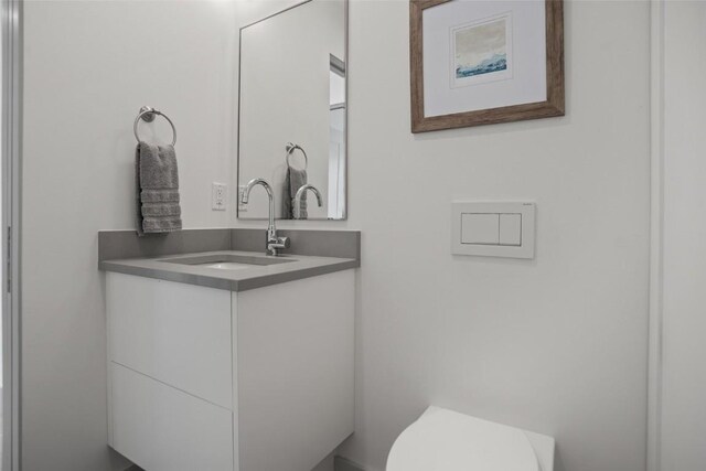 bathroom with vanity and toilet