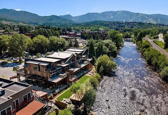 birds eye view of property featuring a mountain view