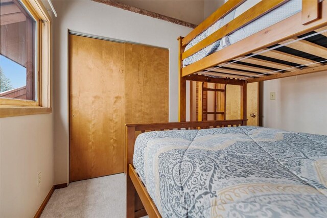 carpeted bedroom featuring a closet