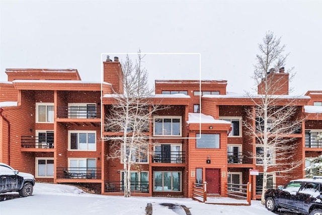 view of snow covered property