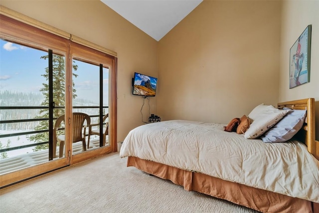 carpeted bedroom featuring multiple windows and lofted ceiling