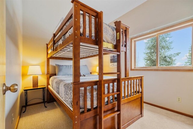 bedroom featuring light colored carpet