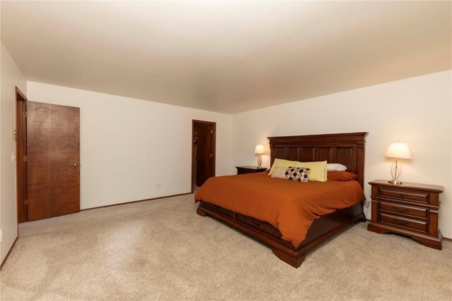 bedroom with light colored carpet