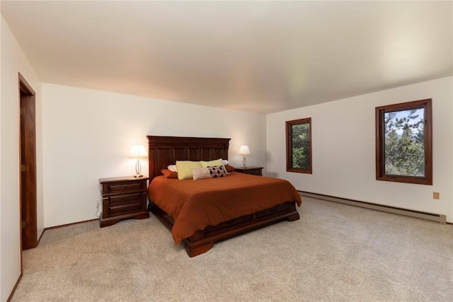 bedroom with light colored carpet and baseboard heating