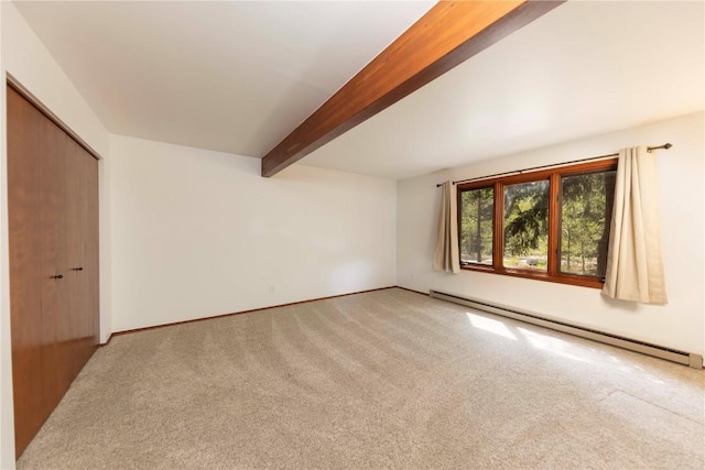 interior space featuring beam ceiling, carpet floors, and a baseboard heating unit