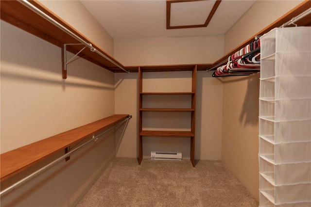 spacious closet with light carpet and a baseboard radiator