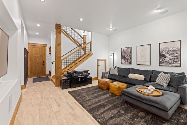 living room with light hardwood / wood-style flooring