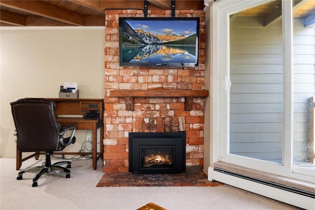 office space with beam ceiling, a large fireplace, a baseboard radiator, carpet, and wood ceiling