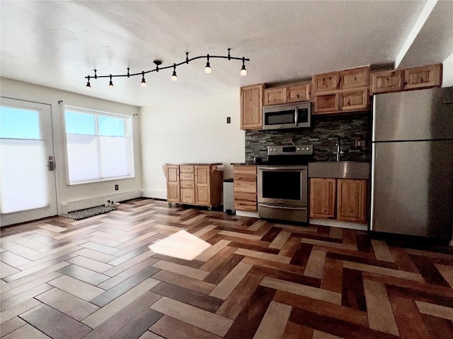 kitchen featuring sink, stainless steel appliances, decorative backsplash, and dark parquet flooring