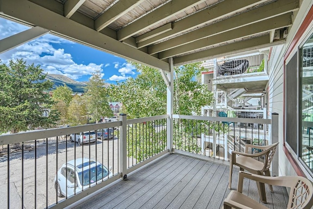 wooden deck with a mountain view