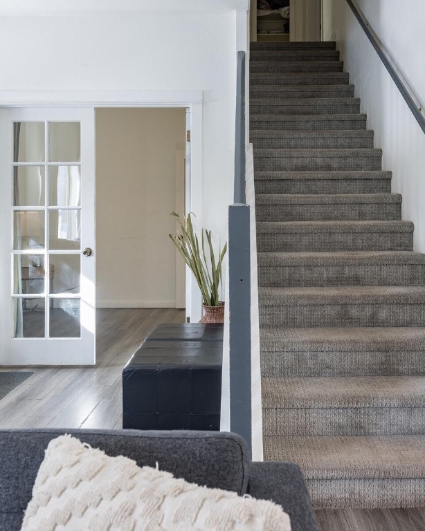 stairway featuring hardwood / wood-style floors