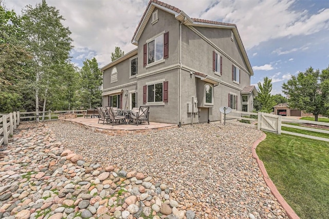 rear view of property with a patio area