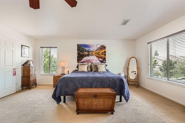 carpeted bedroom featuring ceiling fan