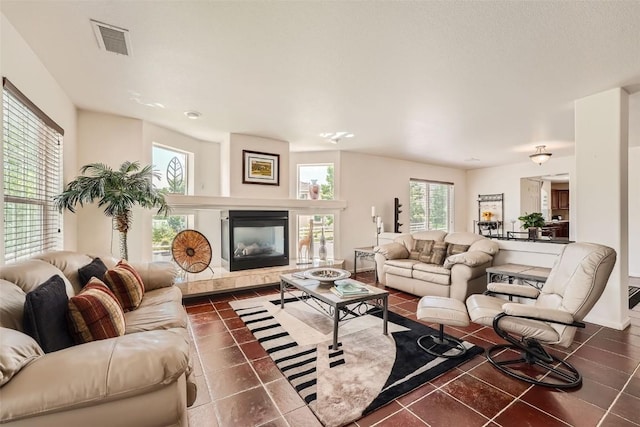 tiled living room with a fireplace