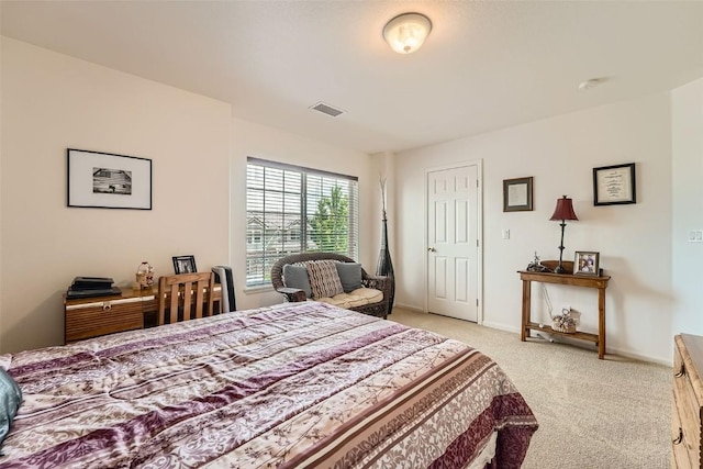 bedroom featuring light colored carpet