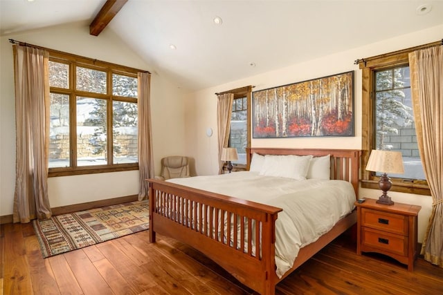 bedroom with hardwood / wood-style floors and vaulted ceiling with beams