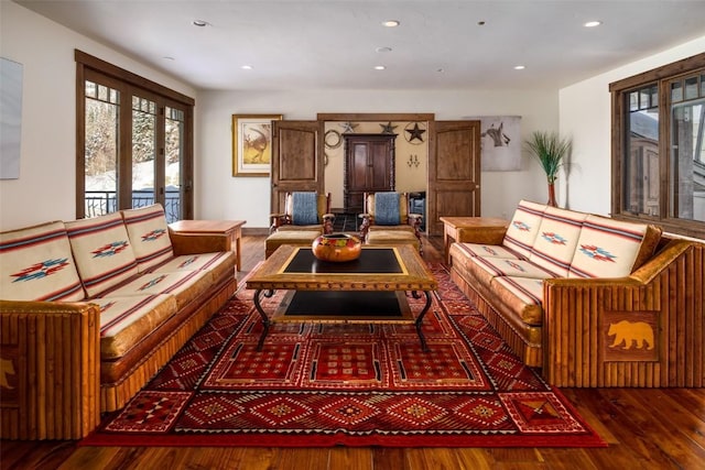 sitting room with dark wood-type flooring