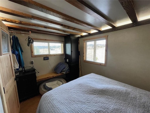 bedroom featuring beam ceiling