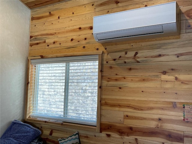 interior details featuring a wall mounted air conditioner and wooden walls