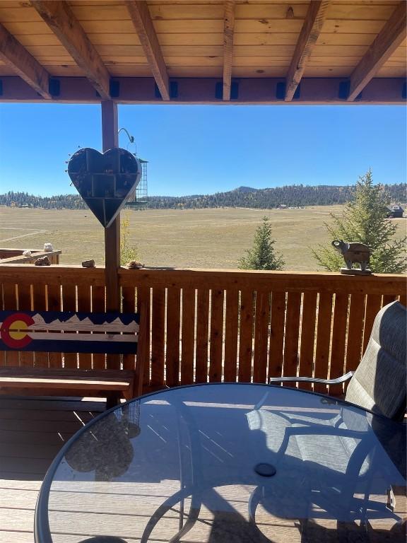 wooden deck featuring a rural view