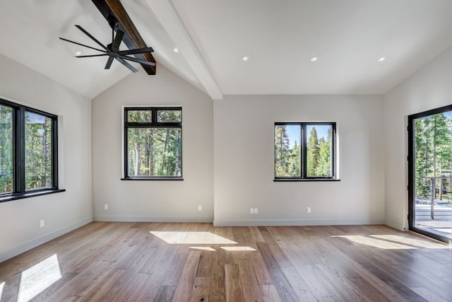 empty room with vaulted ceiling with beams, light hardwood / wood-style floors, and ceiling fan