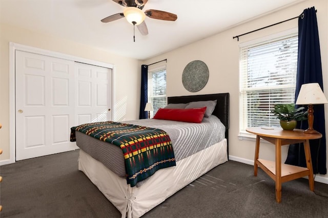 bedroom featuring ceiling fan, dark carpet, and a closet