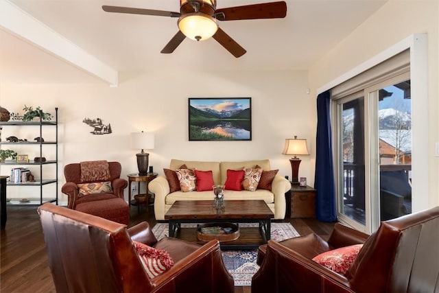 living room with ceiling fan, dark wood-type flooring, and beam ceiling