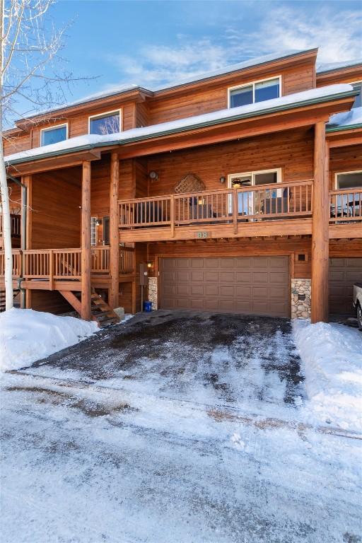 log cabin featuring a garage