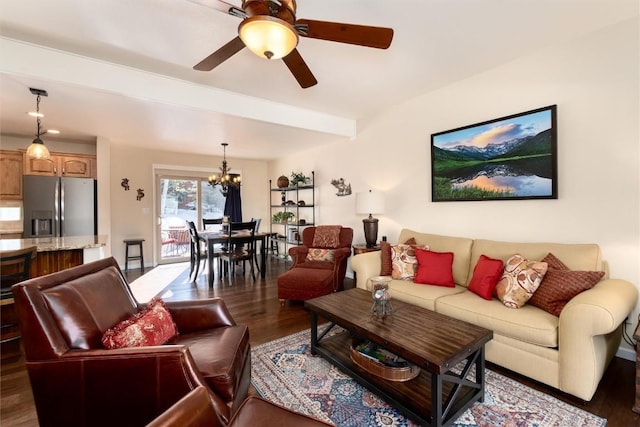 living room featuring dark hardwood / wood-style flooring and ceiling fan with notable chandelier