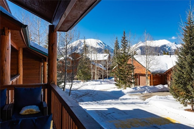 exterior space with a deck with mountain view