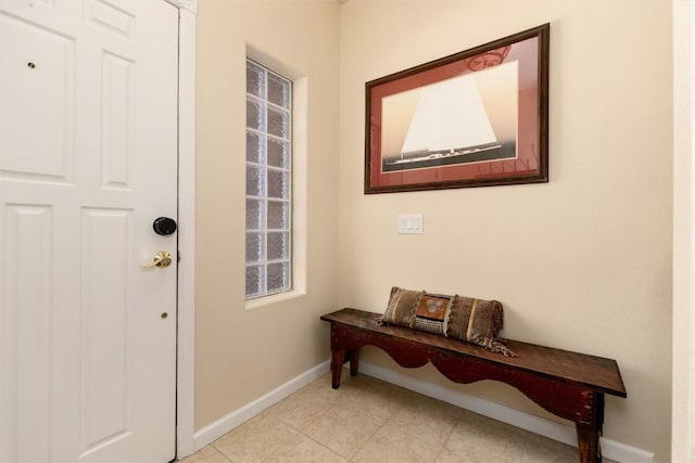 entryway with light tile patterned flooring