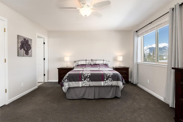 bedroom with ceiling fan and dark colored carpet