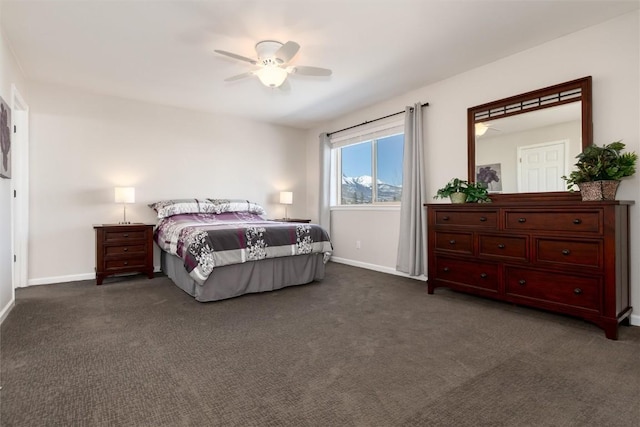 bedroom with ceiling fan and dark colored carpet