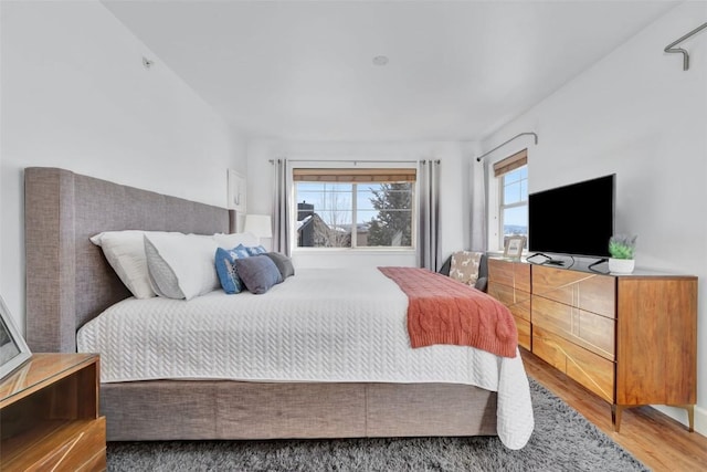 bedroom featuring wood finished floors