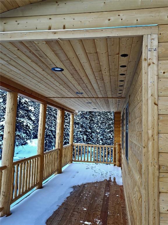 view of snow covered deck