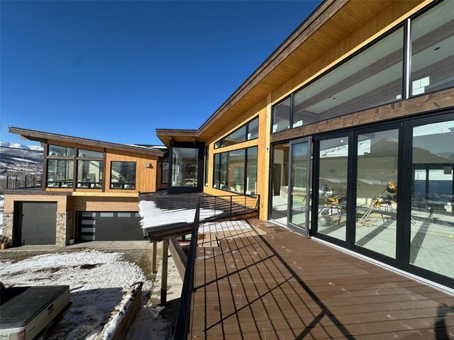 unfurnished sunroom with a mountain view