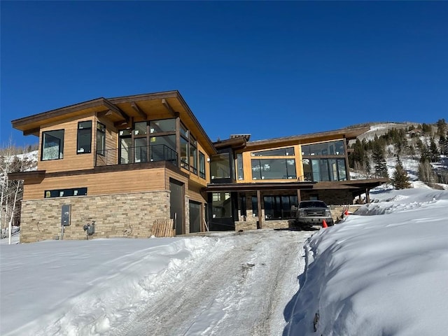 unfurnished sunroom featuring a mountain view