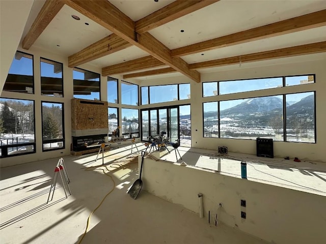 unfurnished sunroom featuring lofted ceiling